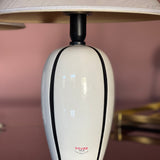 Pair of 1980s Italian G G Luce white ceramic lamps with black stripe