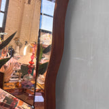1930s Italian chunky peach wood framed wavy mirror