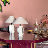 Pair of 1980s Italian G G Luce white ceramic lamps with black stripe