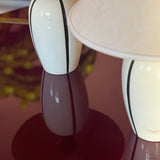 Pair of 1980s Italian G G Luce white ceramic lamps with black stripe