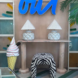 1990s cafe illuminated ‘OUI’ sign