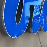 1990s cafe illuminated ‘OUI’ sign