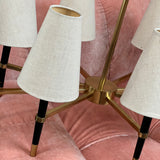 Large wide mid century black and brass chandelier.