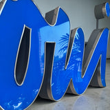 1990s cafe illuminated ‘OUI’ sign