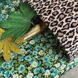 1970s pair of Tomasso Barbi leaf wall lights with leopard print shades