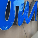1990s cafe illuminated ‘OUI’ sign