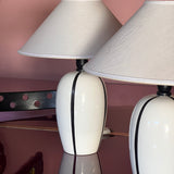 Pair of 1980s Italian G G Luce white ceramic lamps with black stripe