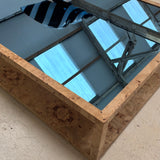 Large Italian burr wood coffee table with blue mirror top.