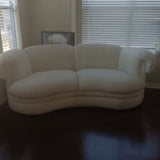 1980s American ivory curved cloud sofa.