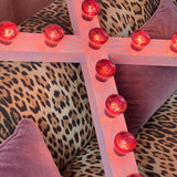 Pink circus wall light cross