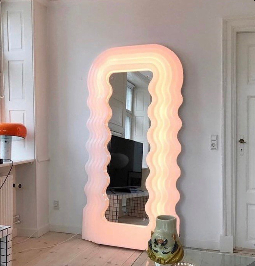 Ultrafragola Mirror by Ettore Sottsass- lighting up a living room