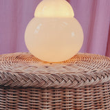 Trompe L’oeil draped wicker side table