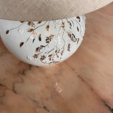 white and gold ceramic lamp