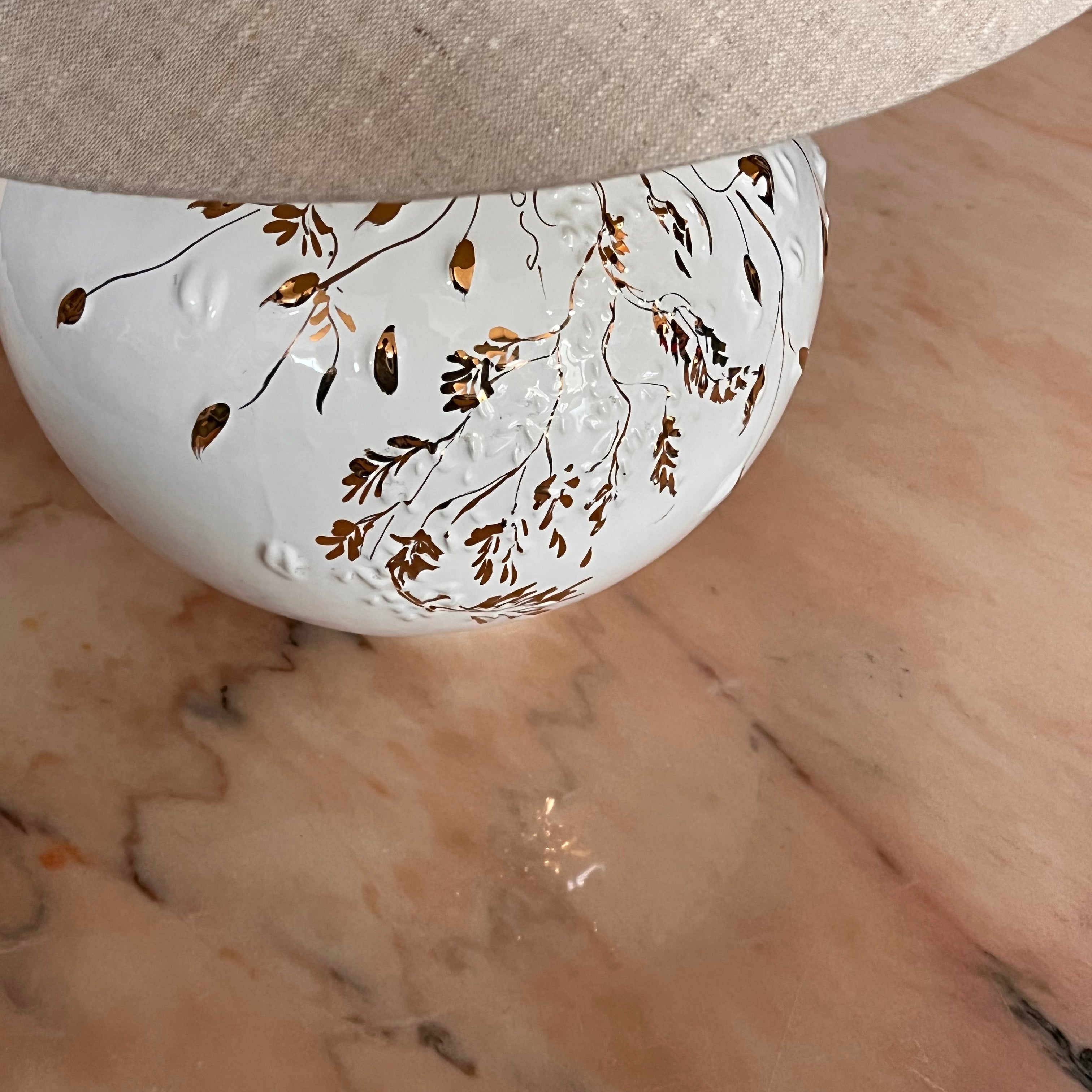 white and gold ceramic lamp