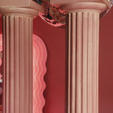 Pair of large pink plaster pillars. Italian 1980s