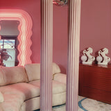 Pair of large pink plaster pillars. Italian 1980s
